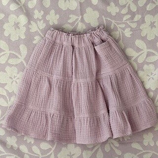 Knee length girls skirt in lilac triple gauze muslin.  Gathered tiers and an oversized pocket to complete the look