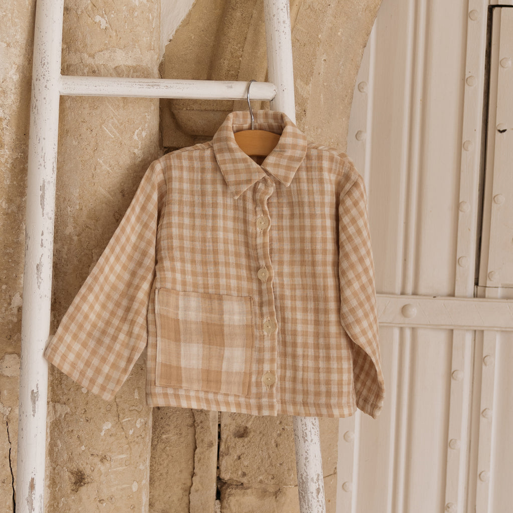 The Bailey unisex childrens sand gingham unisex kids shirt with oversized pocket and button front finish